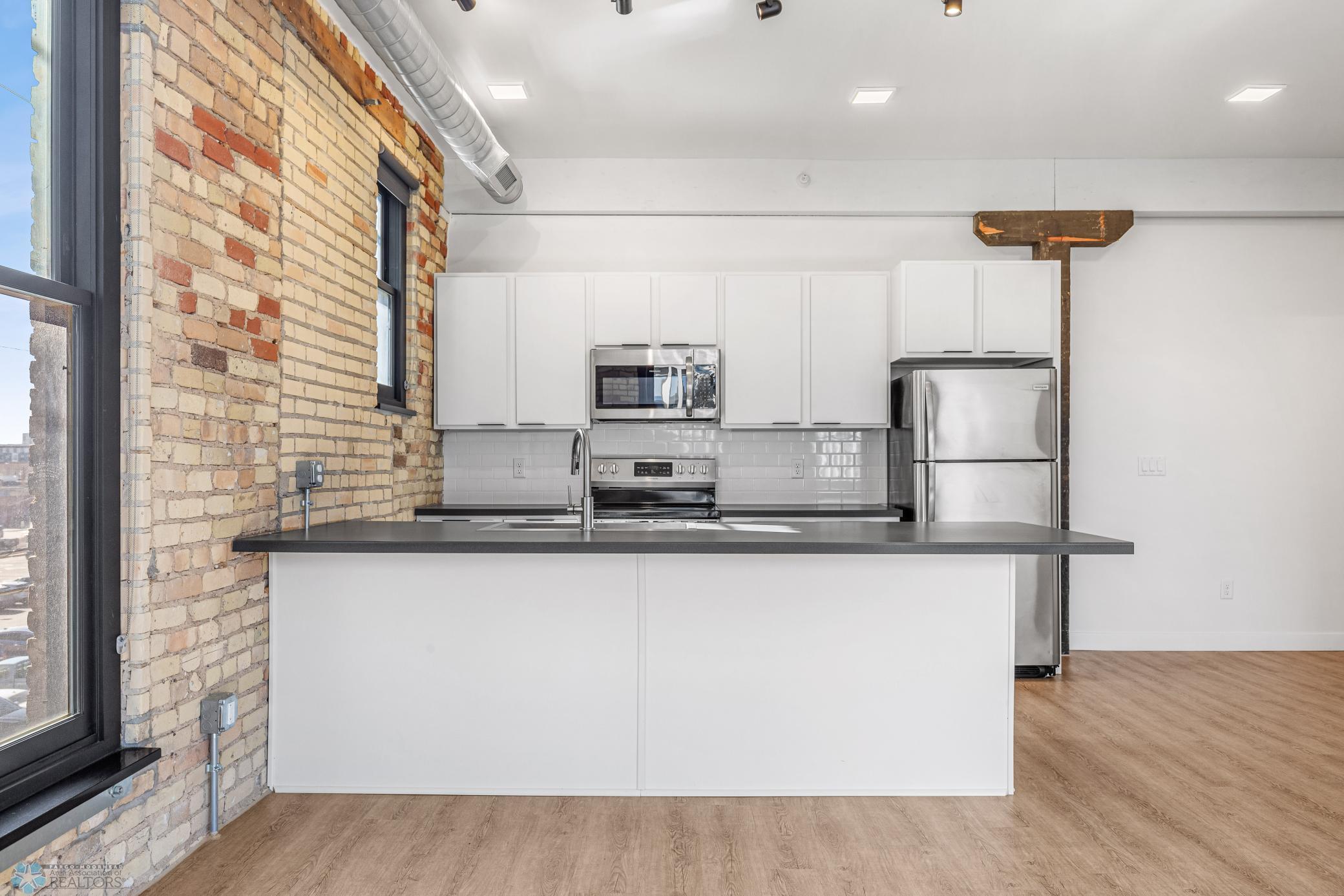 1911 condo for sale at 117 Broadway N, Unit 308 in Fargo, ND — 3 bed, 2 bath (photo 7 of 61)