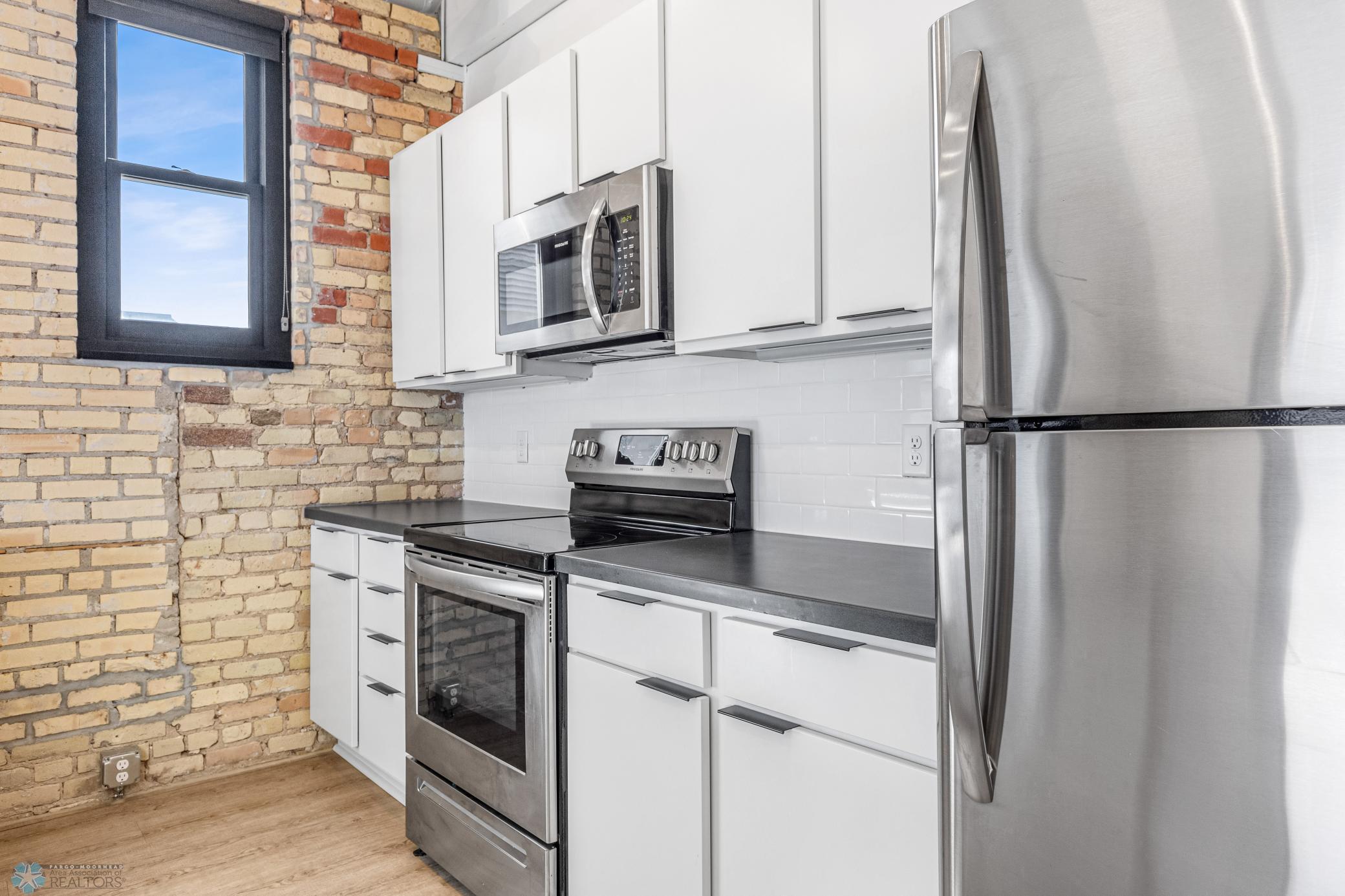 1911 condo for sale at 117 Broadway N, Unit 308 in Fargo, ND — 3 bed, 2 bath (photo 8 of 61)