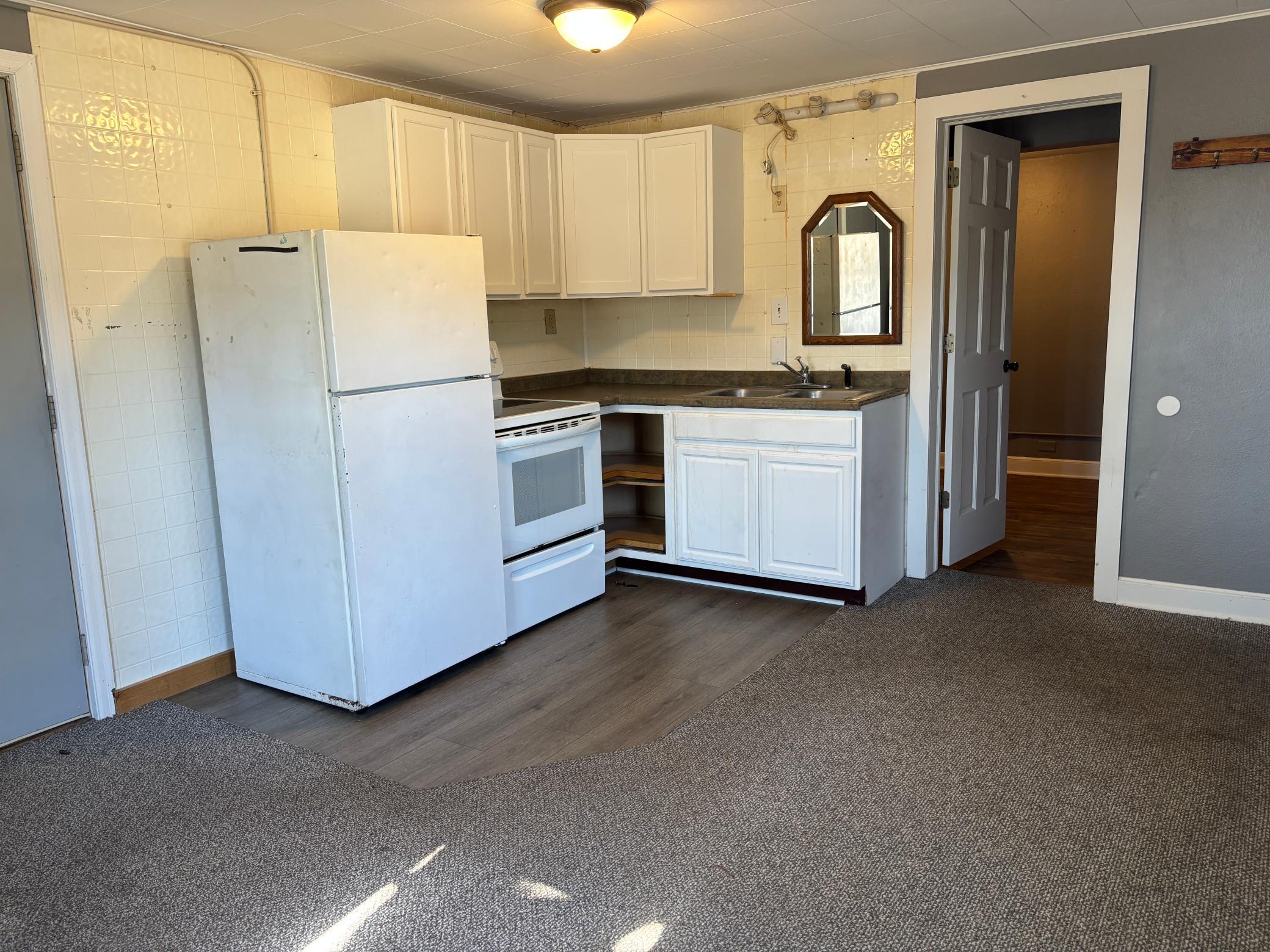 1920 triplex for sale at 215 9th Street NW in Bemidji, MN — 6 bed, 3 bath (photo 4 of 31)