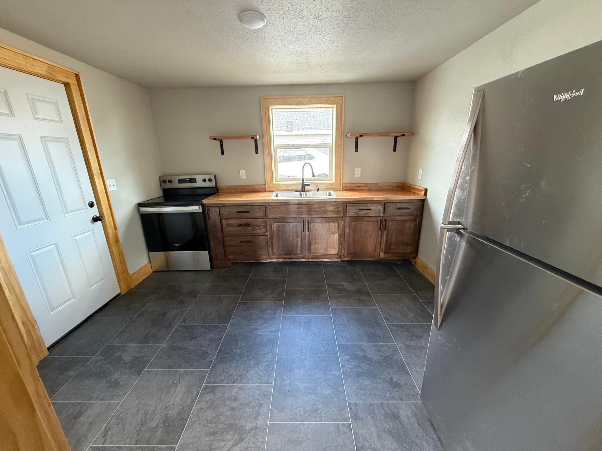 1920 triplex for sale at 215 9th Street NW in Bemidji, MN — 6 bed, 3 bath (photo 8 of 31)