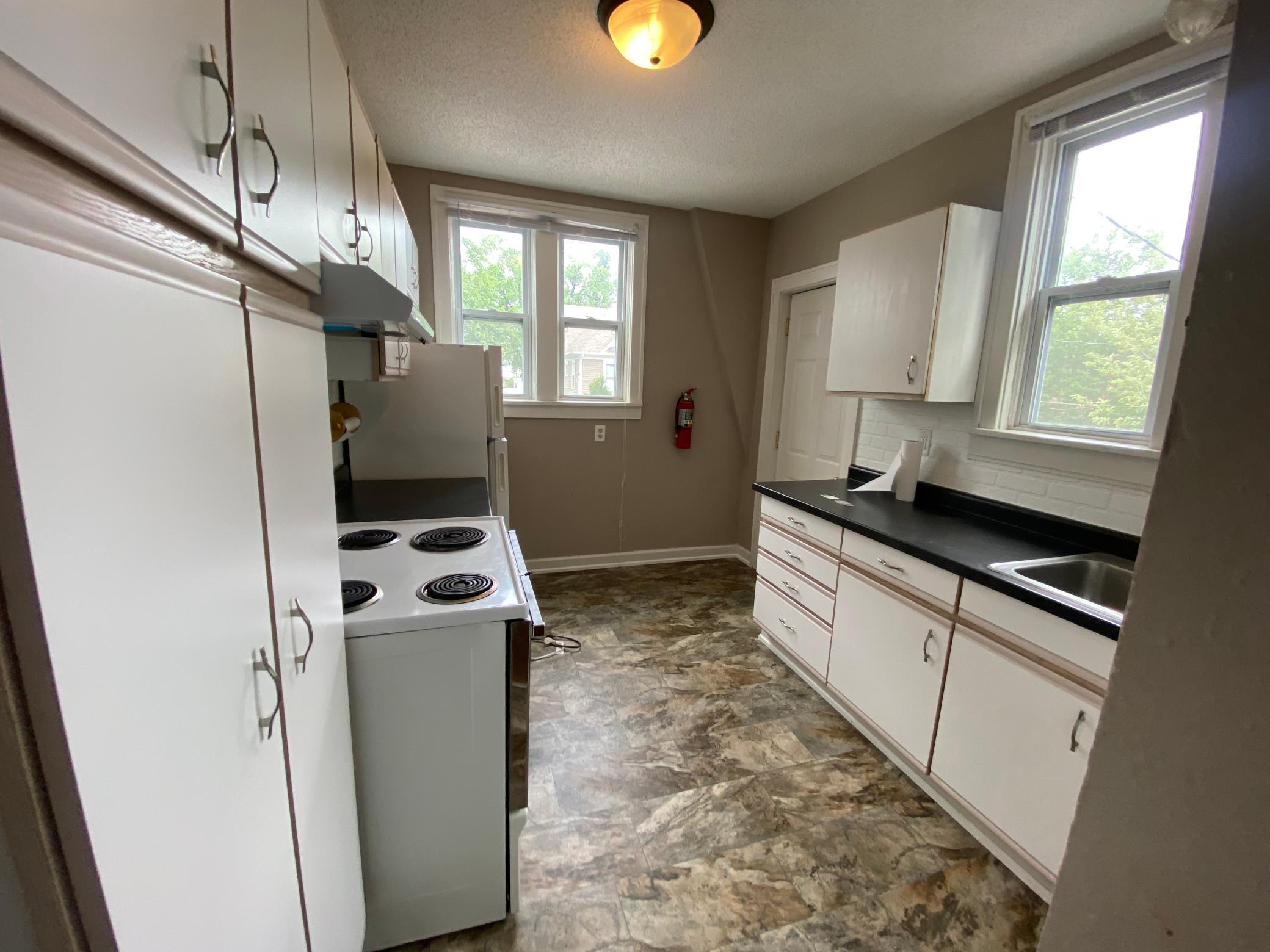 1885 duplex for sale at 214-216 12th Street S in Fargo, ND — 5 bed, 3 bath (photo 9 of 35)