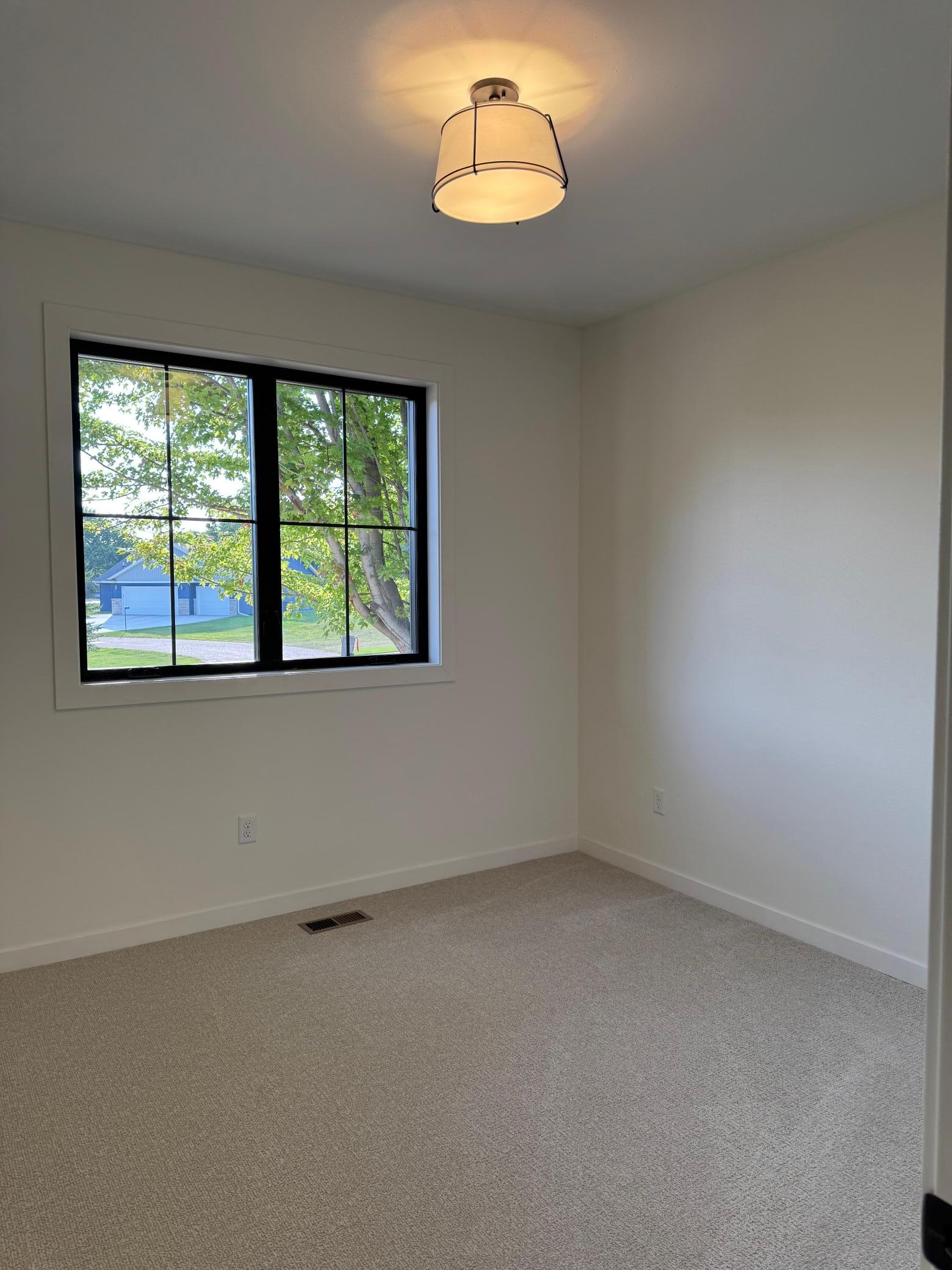 2026 single family home for sale at 1215 Moor Stone Drive NE in Alexandria, MN — 5 bed, 3 bath (photo 27 of 45)