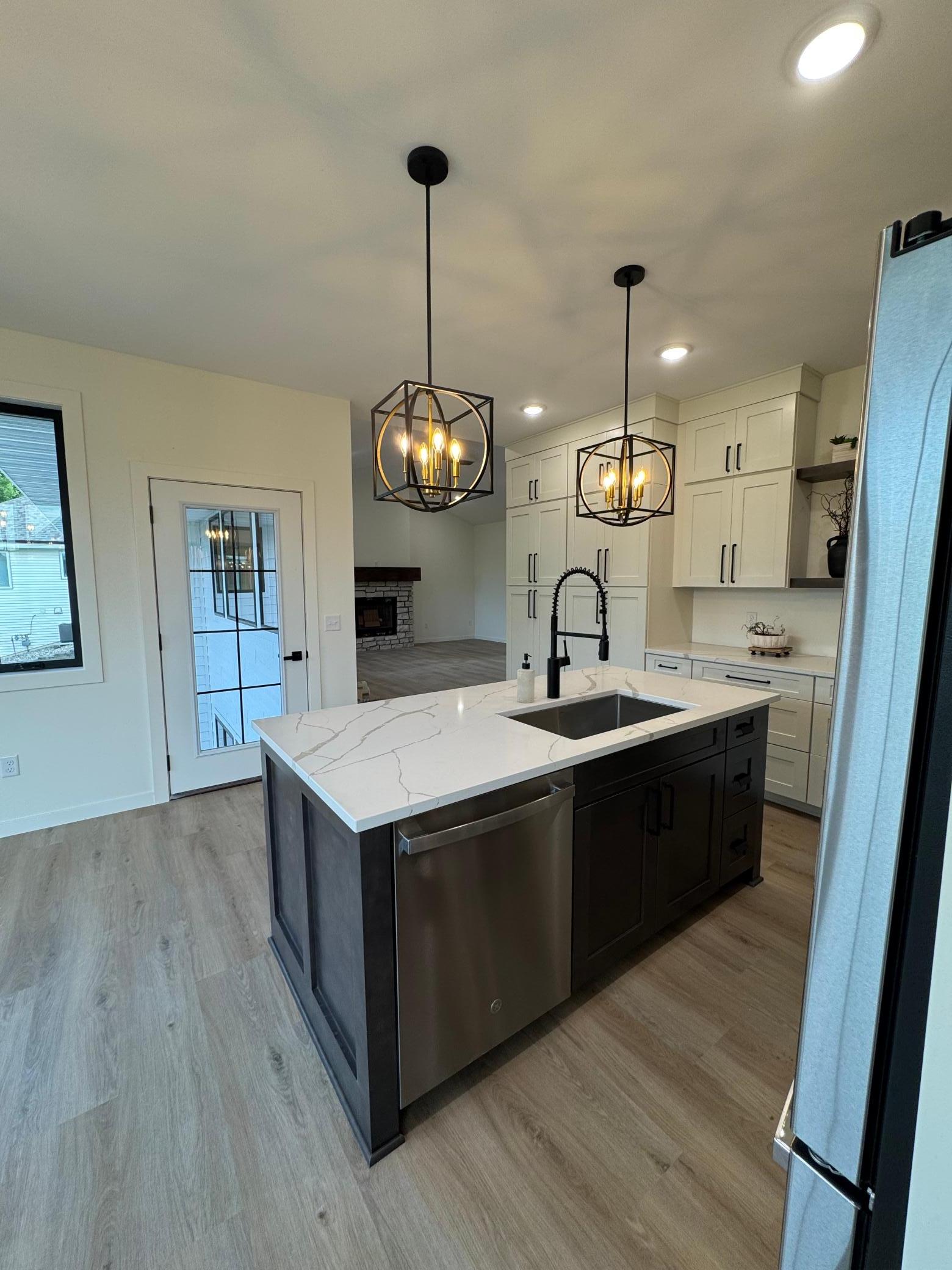 2026 single family home for sale at 1215 Moor Stone Drive NE in Alexandria, MN — 5 bed, 3 bath (photo 10 of 45)