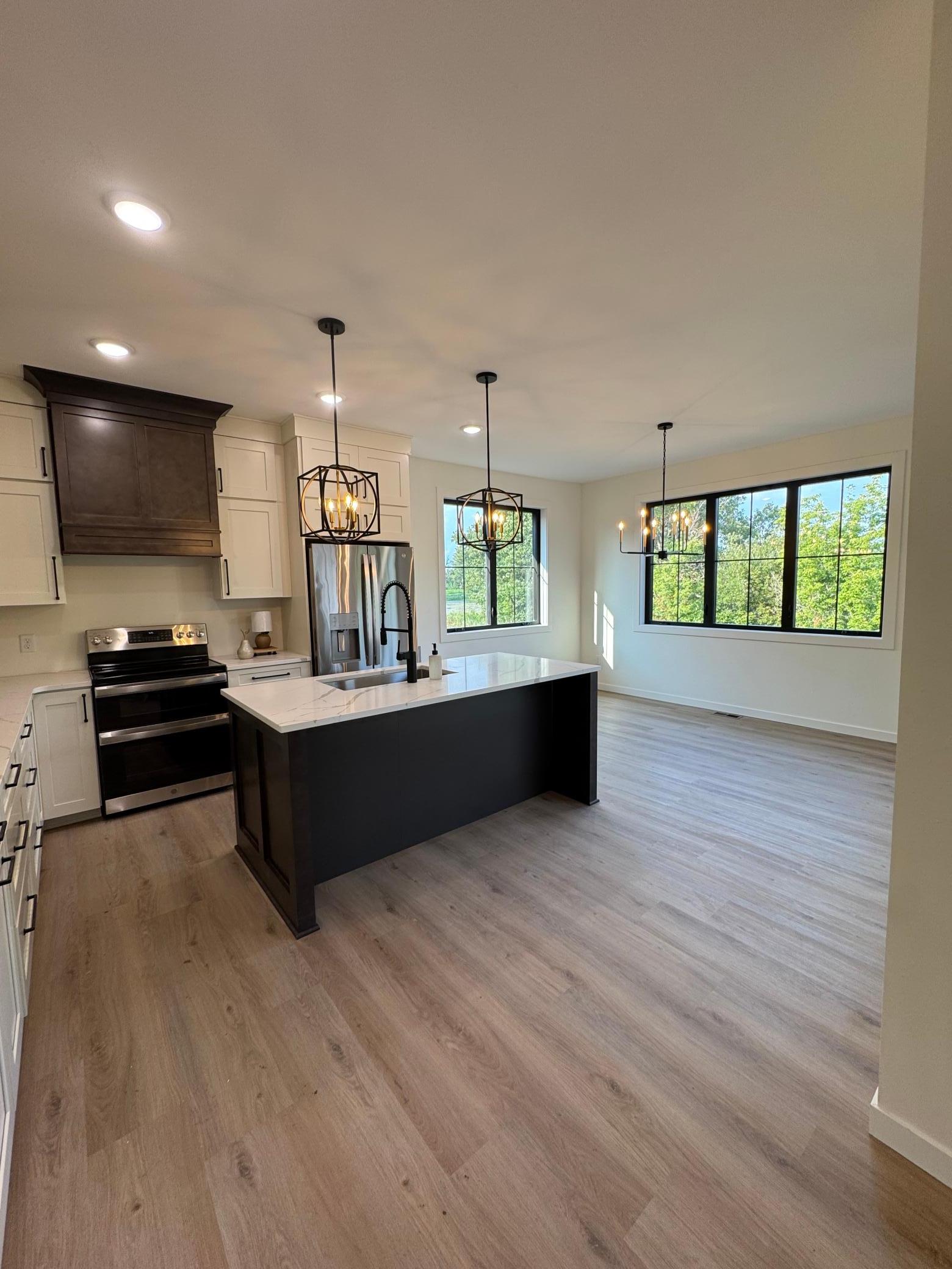 2026 single family home for sale at 1215 Moor Stone Drive NE in Alexandria, MN — 5 bed, 3 bath (photo 5 of 49)