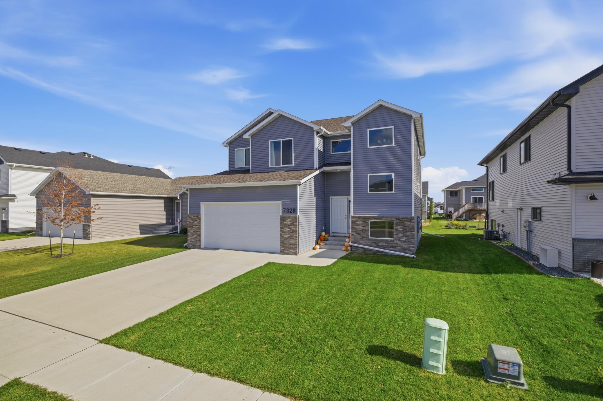 2022 single family home for sale at 7328 Aquiline Drive S in Fargo, ND — 3 bed, 3 bath (photo 2 of 64)